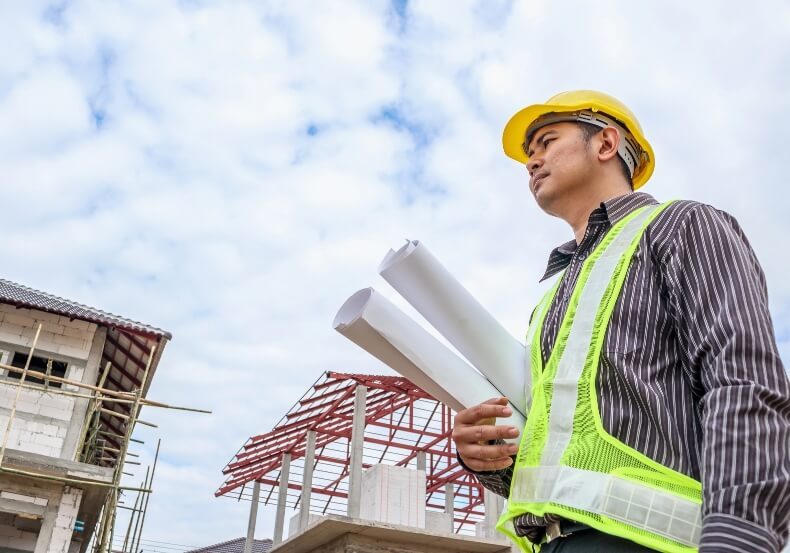 asian-business-man-construction-engineer-worker-protective-helmet-blueprints-paper-hand-house-building-site